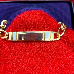 Speidel ID bracelet gold tone with silver inserts on either side of the plate